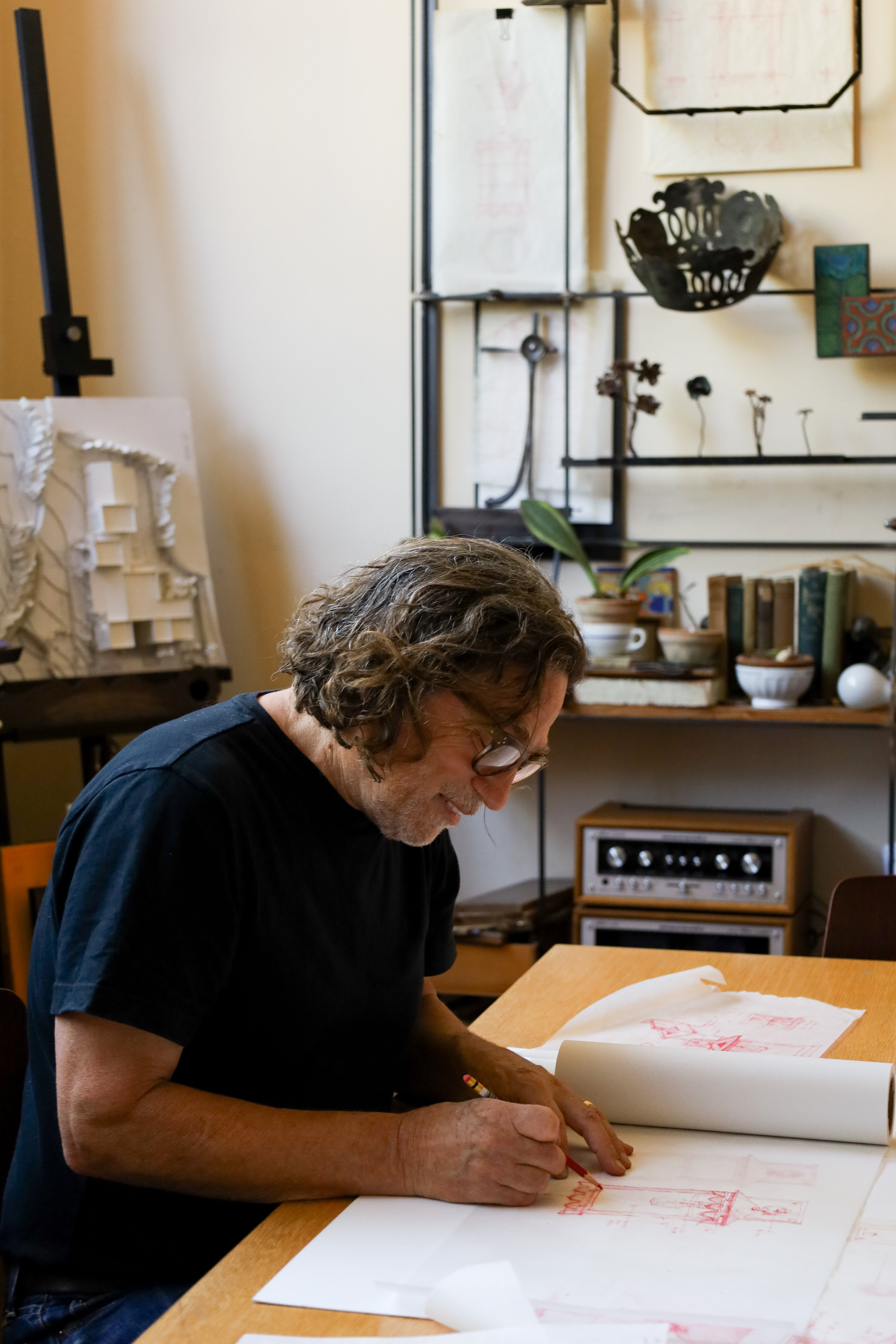 Britt Jewett , Architect of Studio 7, Santa Barbara, drawing architectural drawings of Santa Barbara Lighting Company handmade outdoor light fixtures